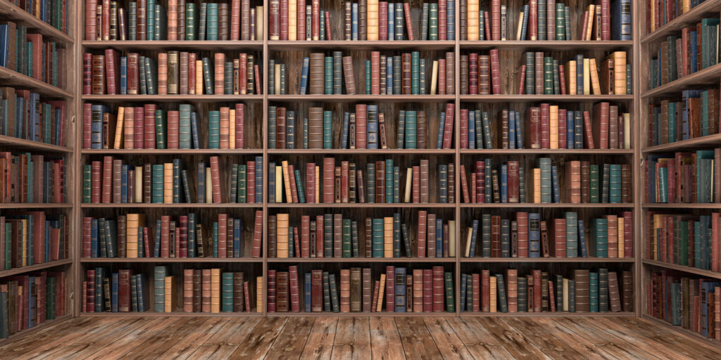 Велика книжкова полиця з великою кількістю книг Велика книжкова полиця з великою кількістю книг
