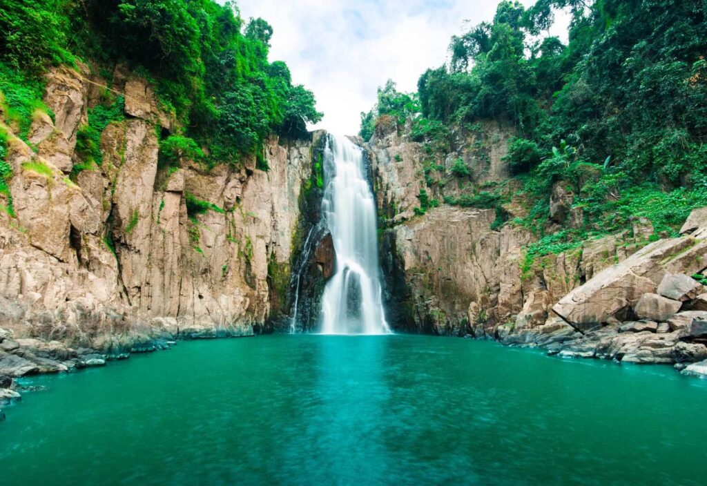 Wall murals Waterfall in a rocky area Wall murals Waterfall in a rocky area