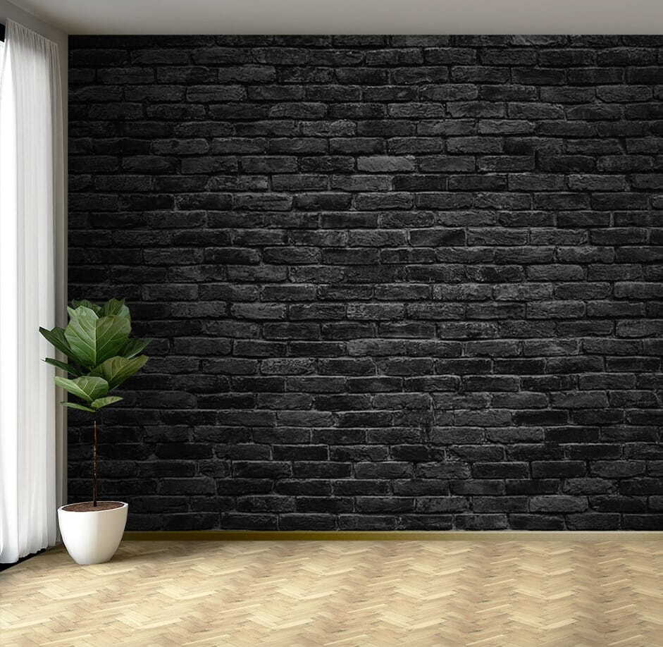 Black brick wall with a white spot Black brick wall with a white spot