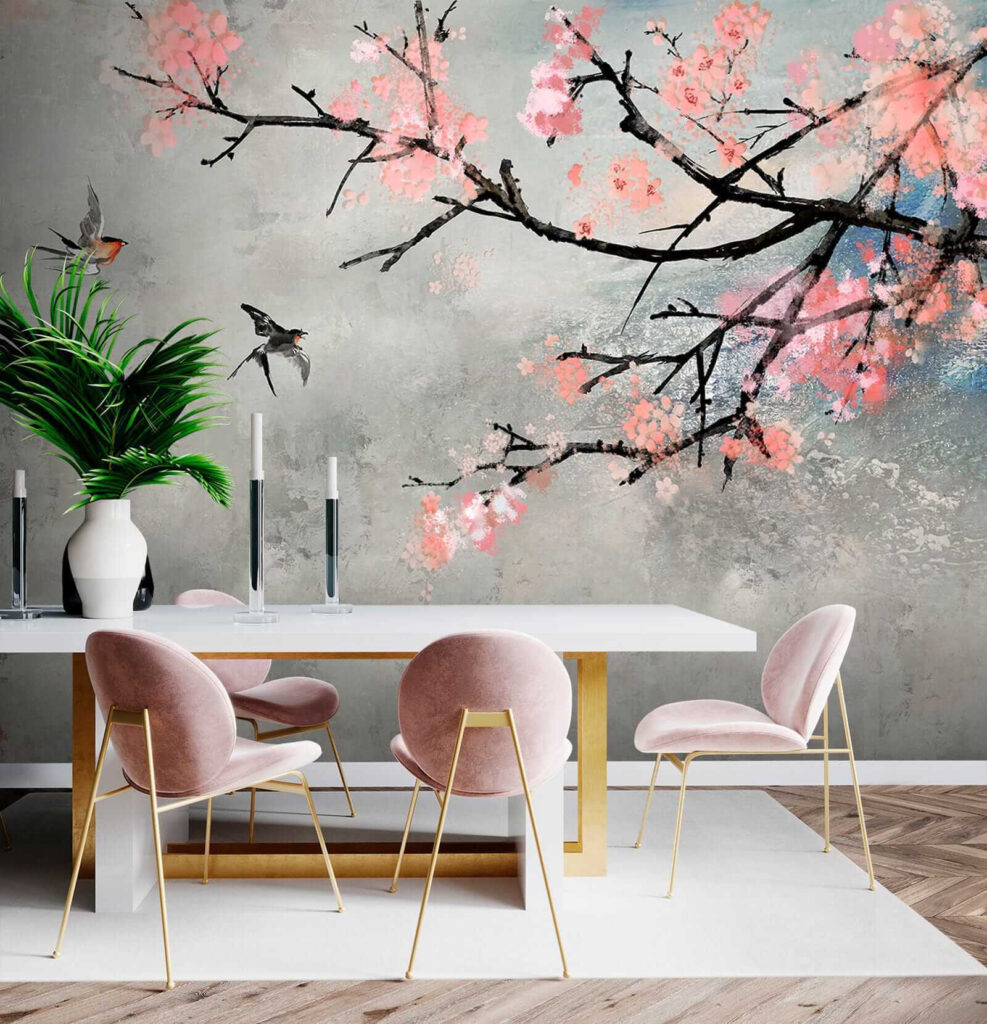 Tree branch with pink flowers and birds flying