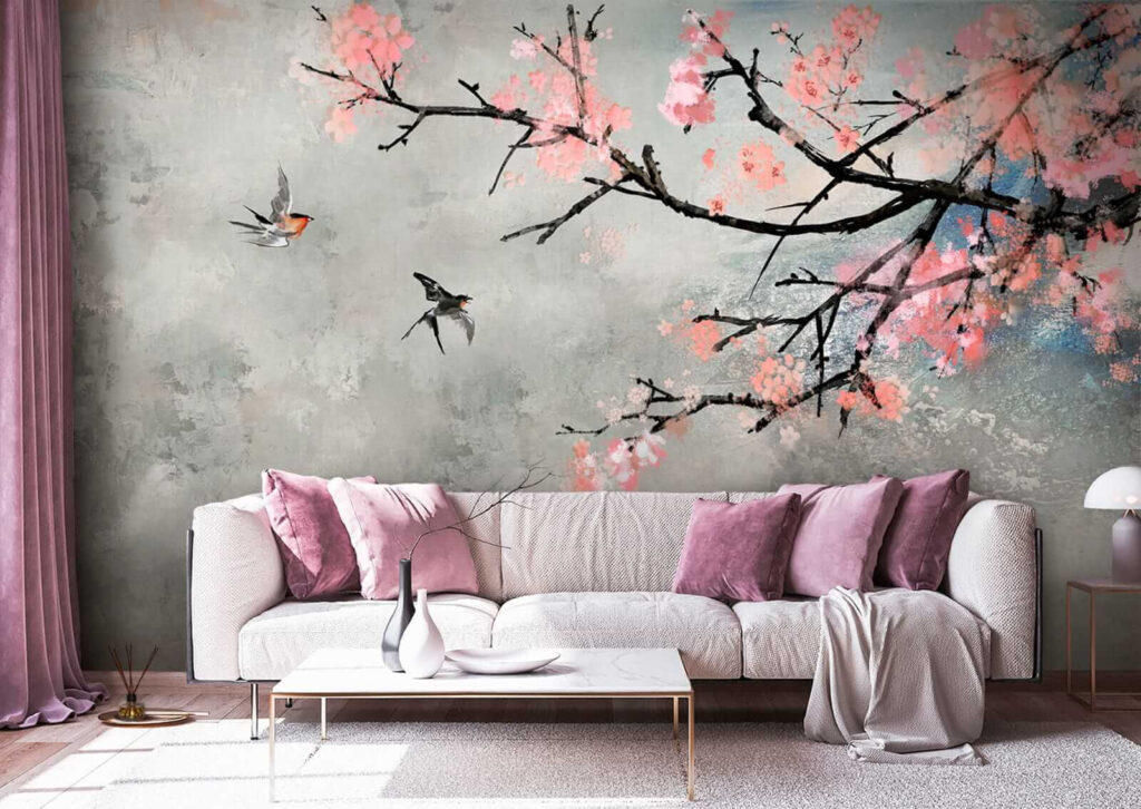 Tree branch with pink flowers and birds flying