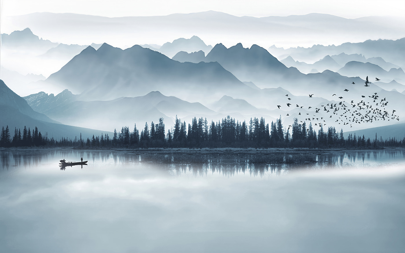 Person in a boat on a lake with mountains in the background