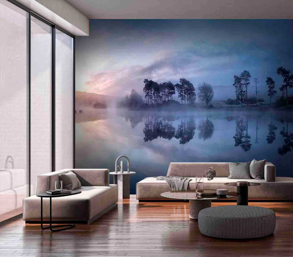 Foggy lake with trees and a blue sky