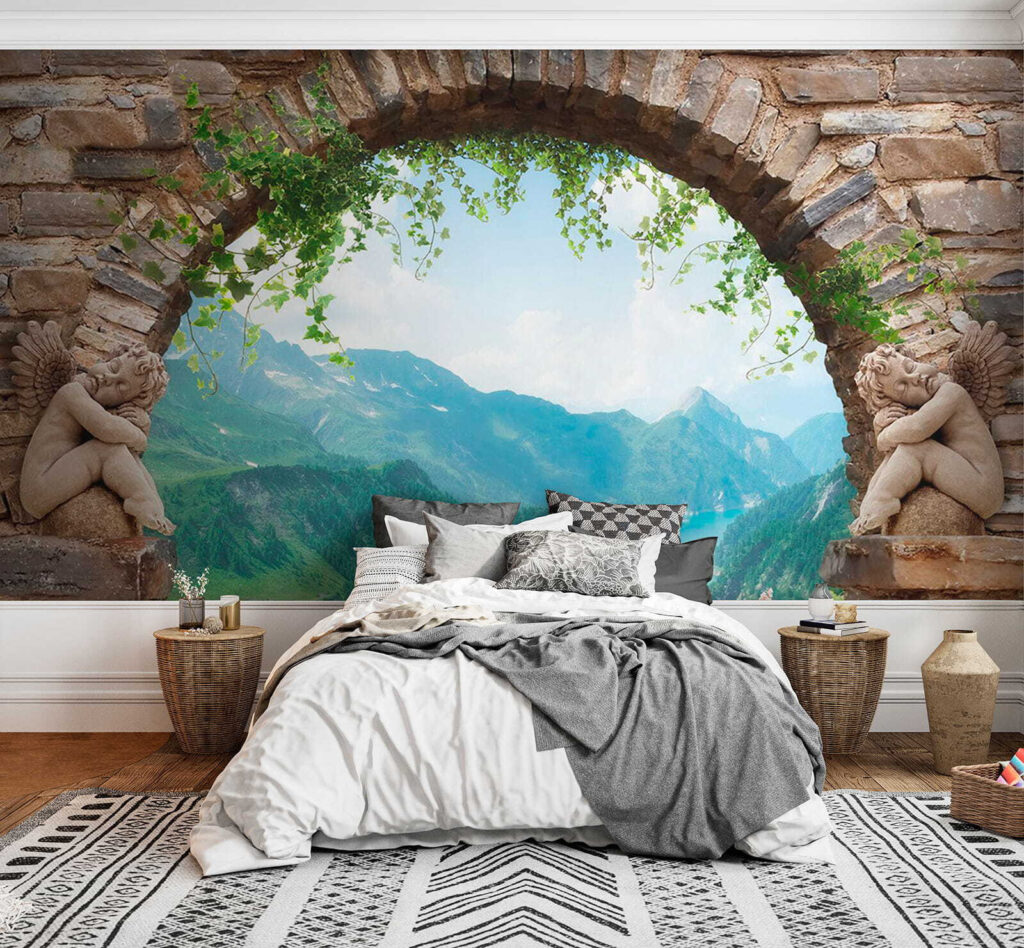 Stone archway with stone statues and a view of a valley and mountains Stone archway with stone statues and a view of a valley and mountains