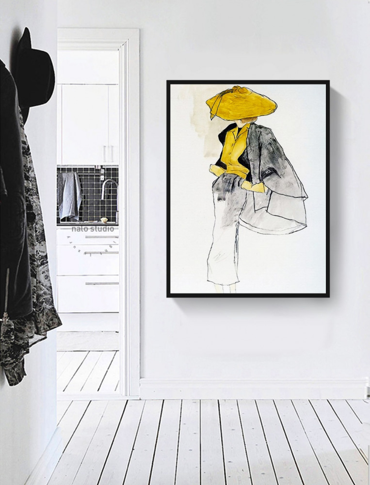 A woman wearing a yellow shirt and grey pants A woman wearing a yellow shirt and grey pants