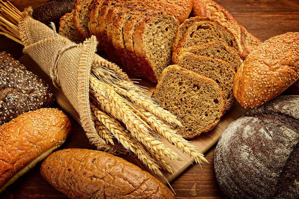 A group of bread on a cutting board A group of bread on a cutting board