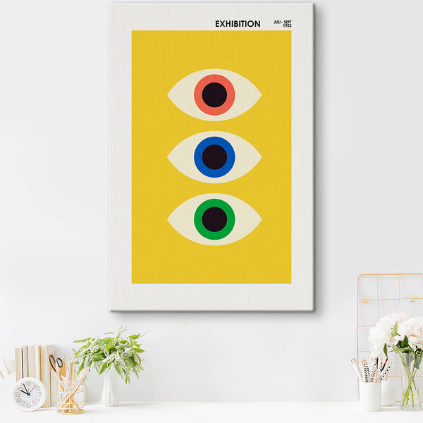 A yellow rectangular object with multi colored eyes