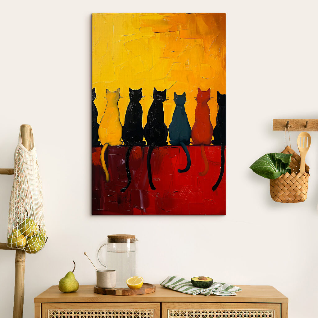 A group of cats sitting on a red surface A group of cats sitting on a red surface