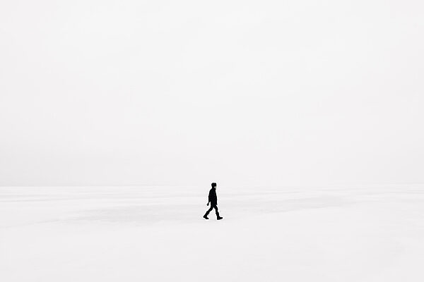 Person walking in the snow Person walking in the snow