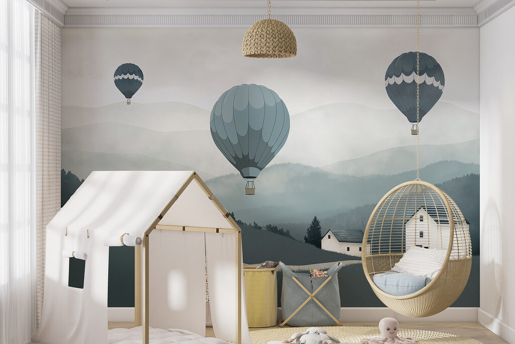 Group of hot air balloons flying over a village