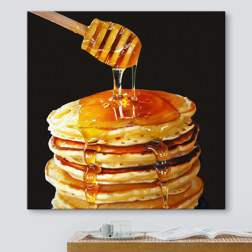 Stack of pancakes with honey dripping from a wooden stick