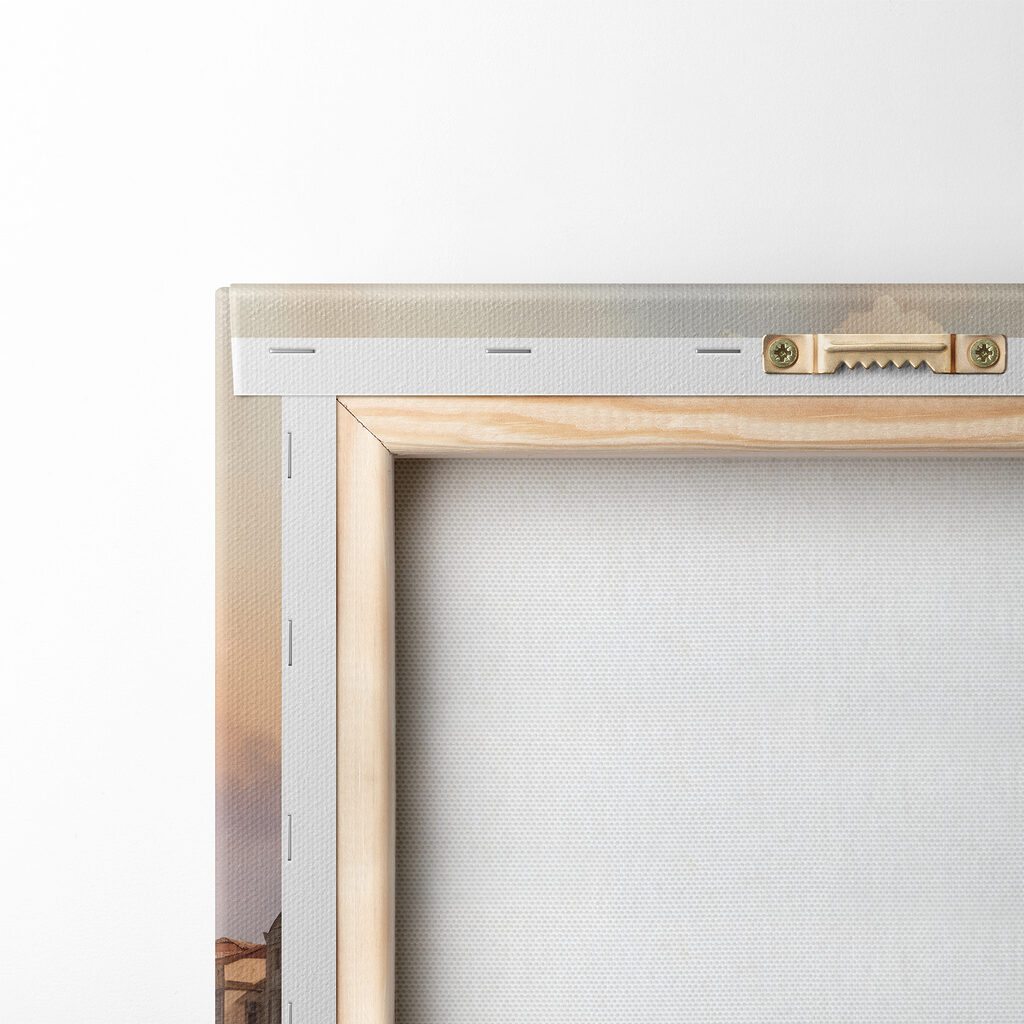 Group of gondolas in a body of water with a large building in the background