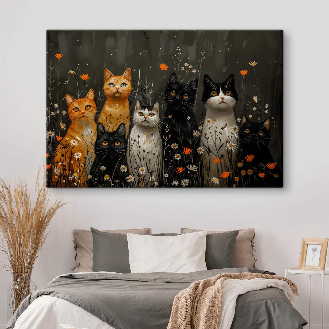 Group of cats in a field of flowers