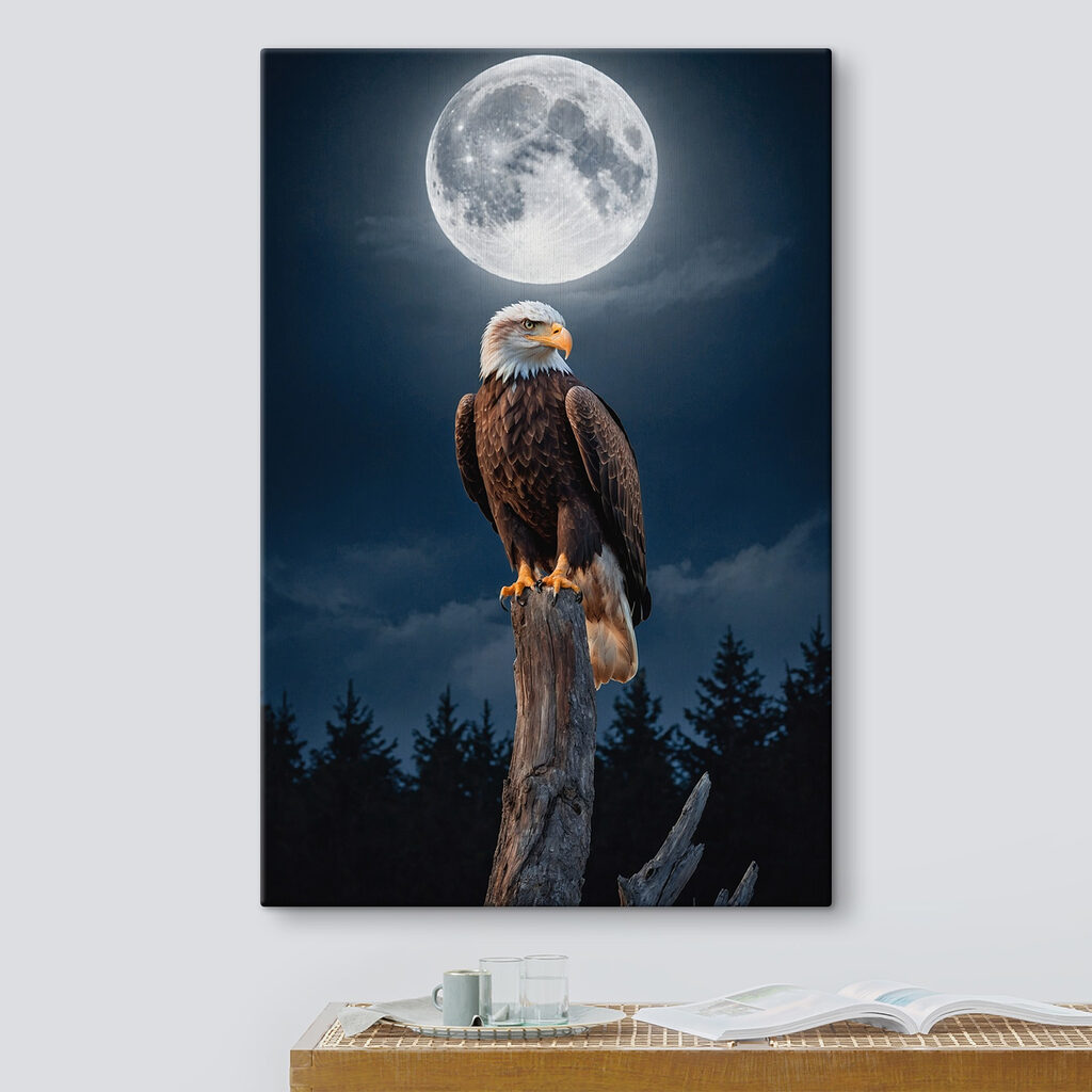 Bald eagle on a post with a full moon in the background