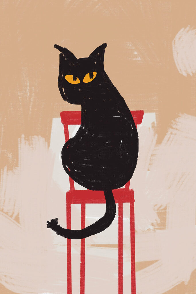 Black cat sitting on a red chair Black cat sitting on a red chair