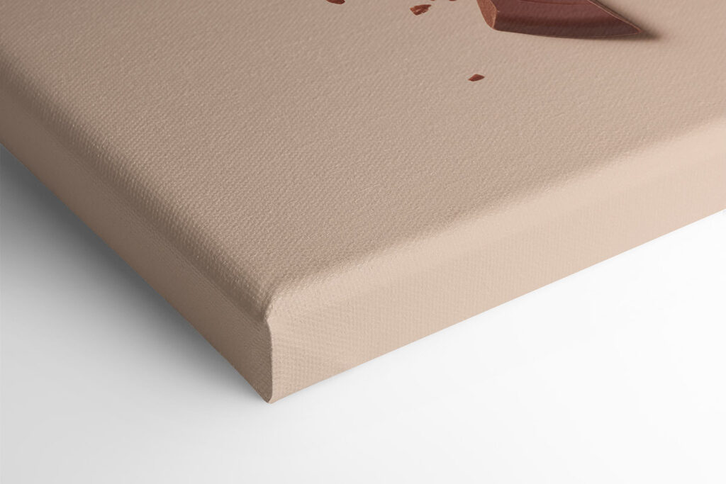 Broken chocolate bar on a pink surface