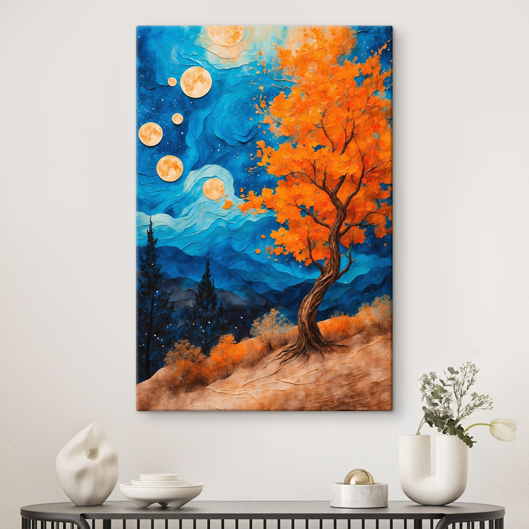 Painting of a tree with orange leaves and blue mountains