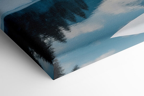 Lake with snow and trees in the background