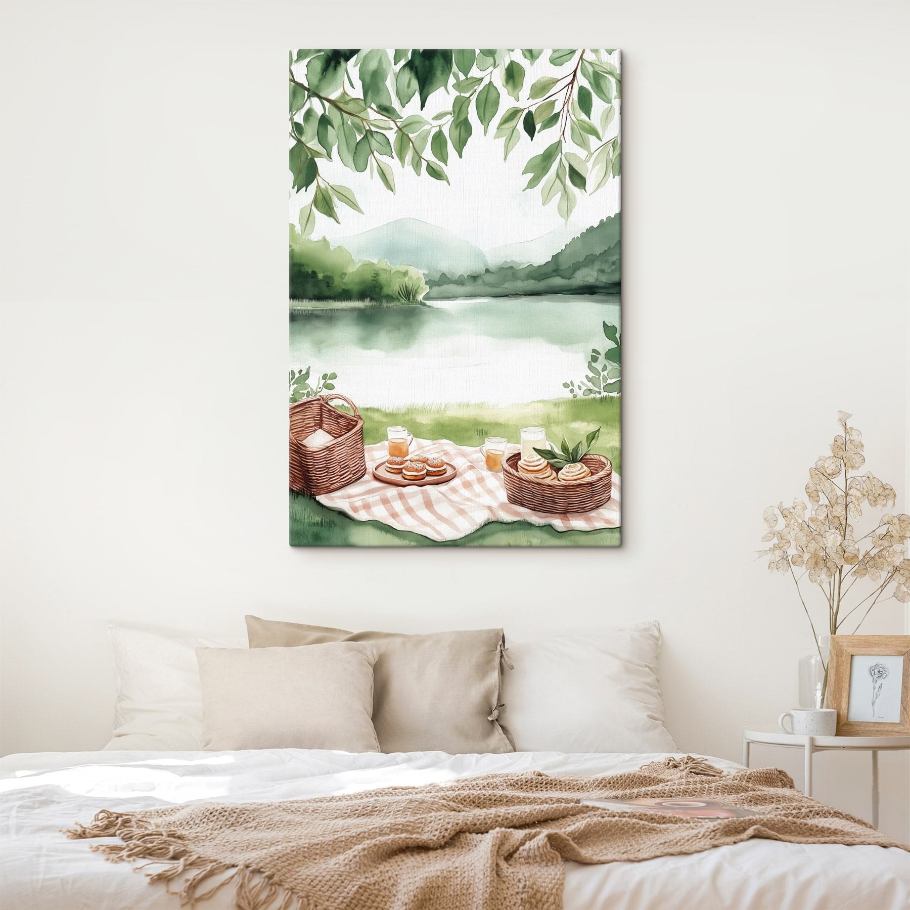 Watercolor painting of a picnic blanket with a basket and food on it