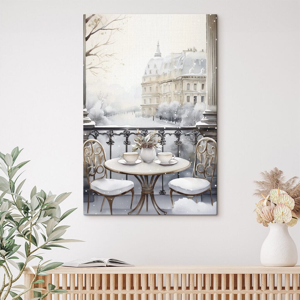 Table with cups and a vase of flowers on it with a snowy landscape