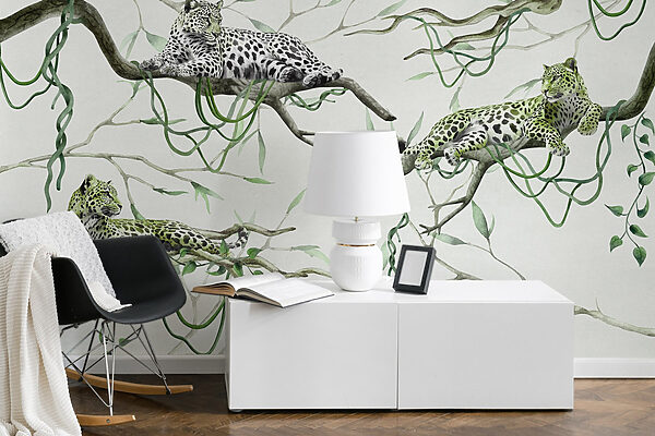 Group of leopards lying on branches