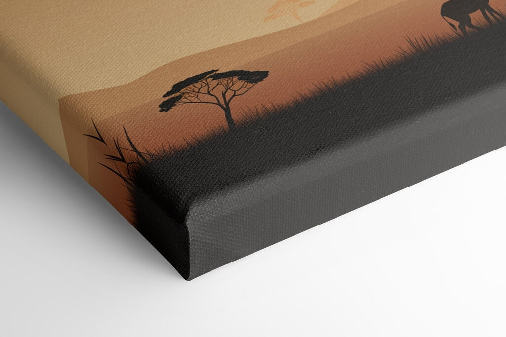 Giraffes walking in a grassy field with trees and a sunset