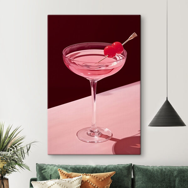 Glass with pink liquid and two cherries on it Glass with pink liquid and two cherries on it