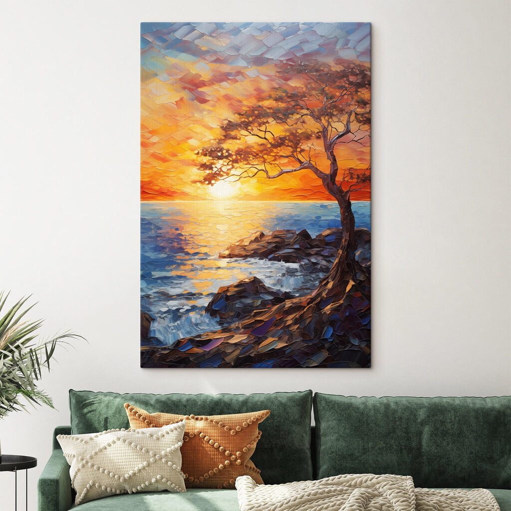 Tree on a rocky shore with a sunset behind it