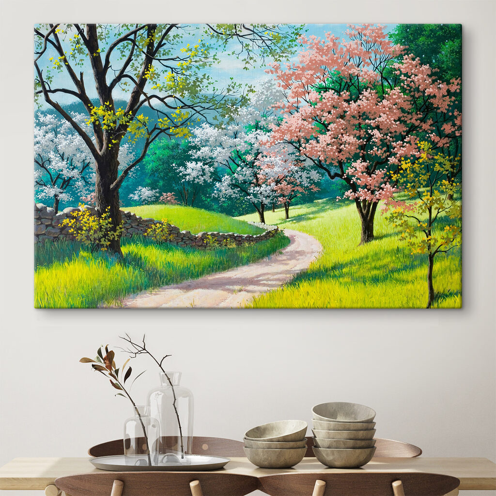 A dirt road through a grassy field with trees and a stone wall A dirt road through a grassy field with trees and a stone wall