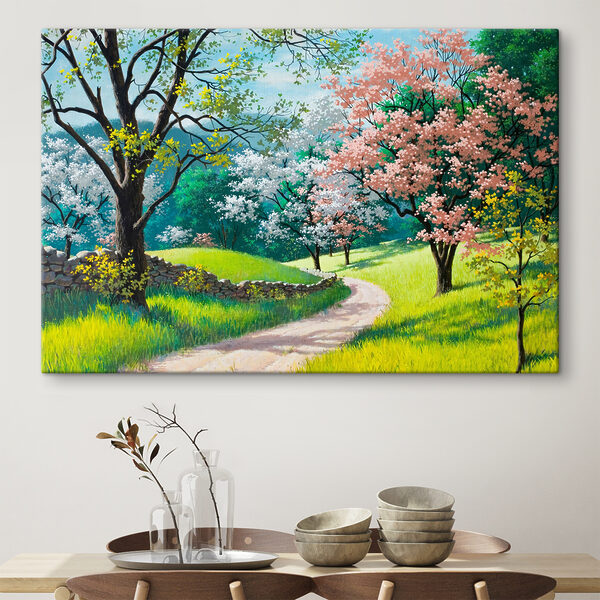 A dirt road through a grassy field with trees and a stone wall A dirt road through a grassy field with trees and a stone wall