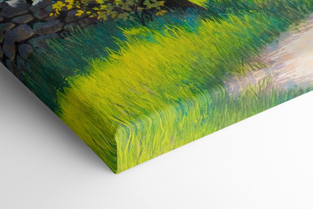 A dirt road through a grassy field with trees and a stone wall A dirt road through a grassy field with trees and a stone wall