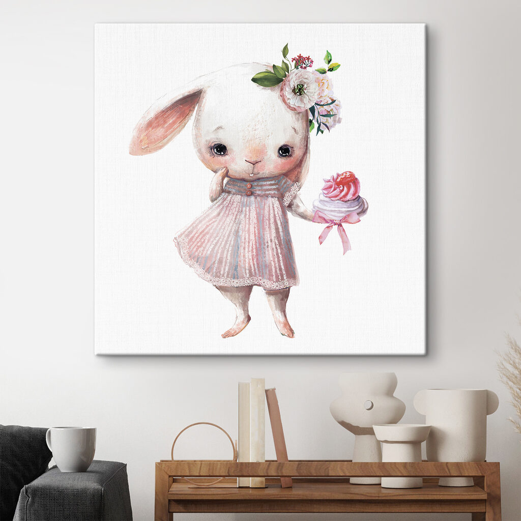 A cartoon of a bunny holding a cupcake A cartoon of a bunny holding a cupcake