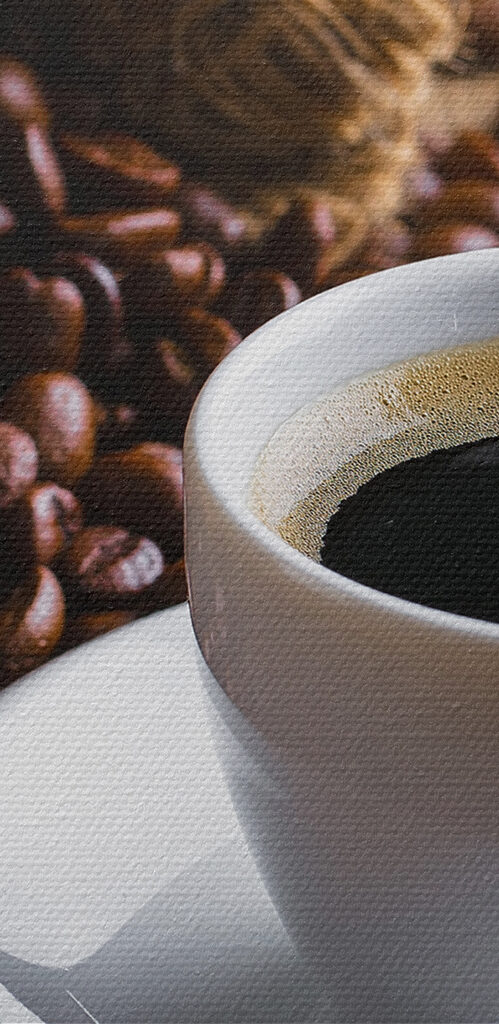 A cup of coffee and a bag of coffee beans A cup of coffee and a bag of coffee beans