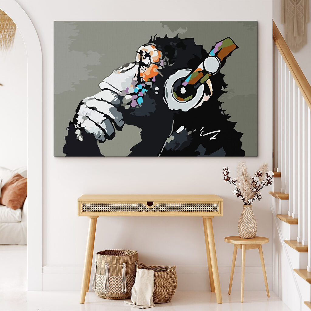 A cartoon of a monkey holding a headphone