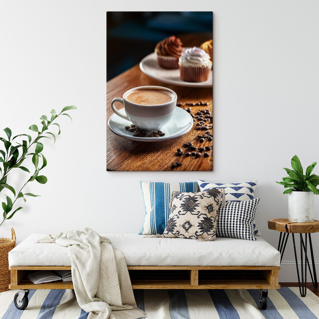 Cup of coffee and cupcakes on a table Cup of coffee and cupcakes on a table