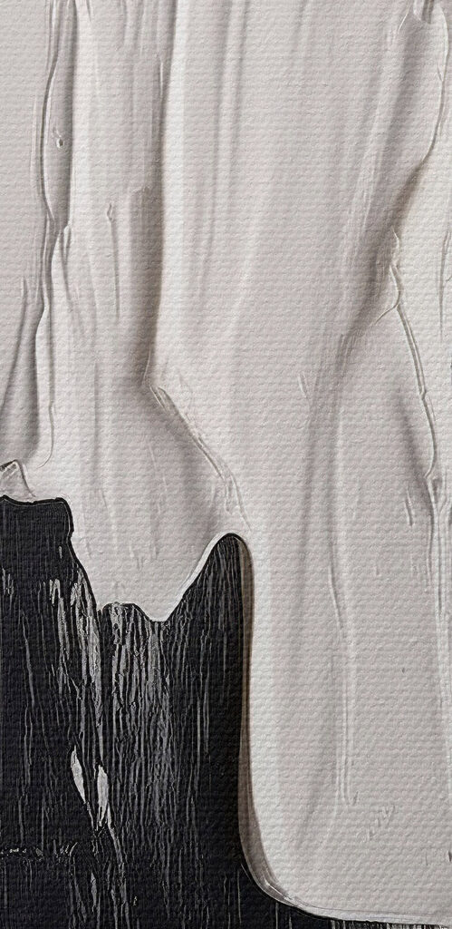 White and black paint on a white surface