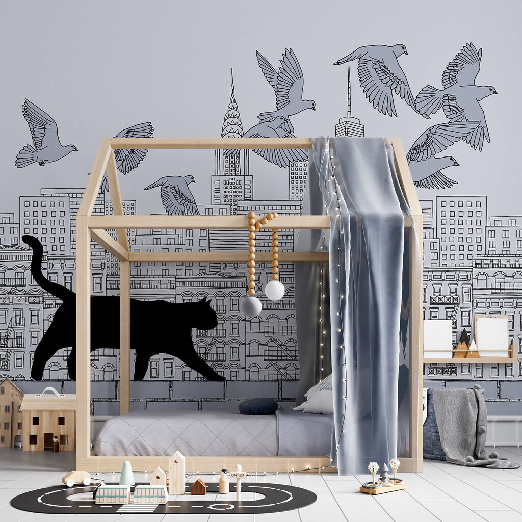 Кіт гуляє по стіні з птахами, що літають у небі