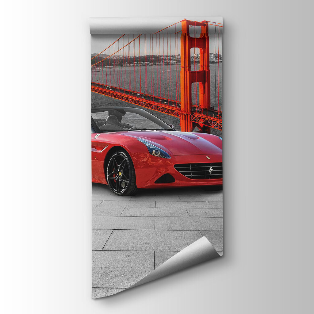 Red sports car on a road with a bridge in the background Red sports car on a road with a bridge in the background