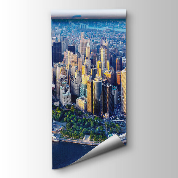 A city with many tall buildings and a body of water