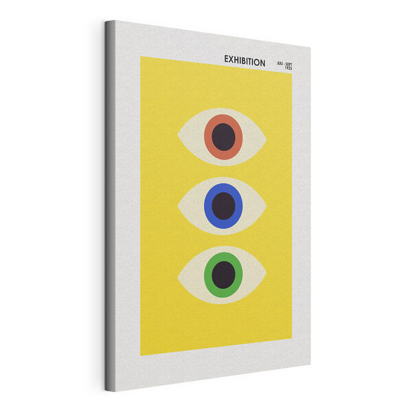A yellow rectangular object with multi colored eyes
