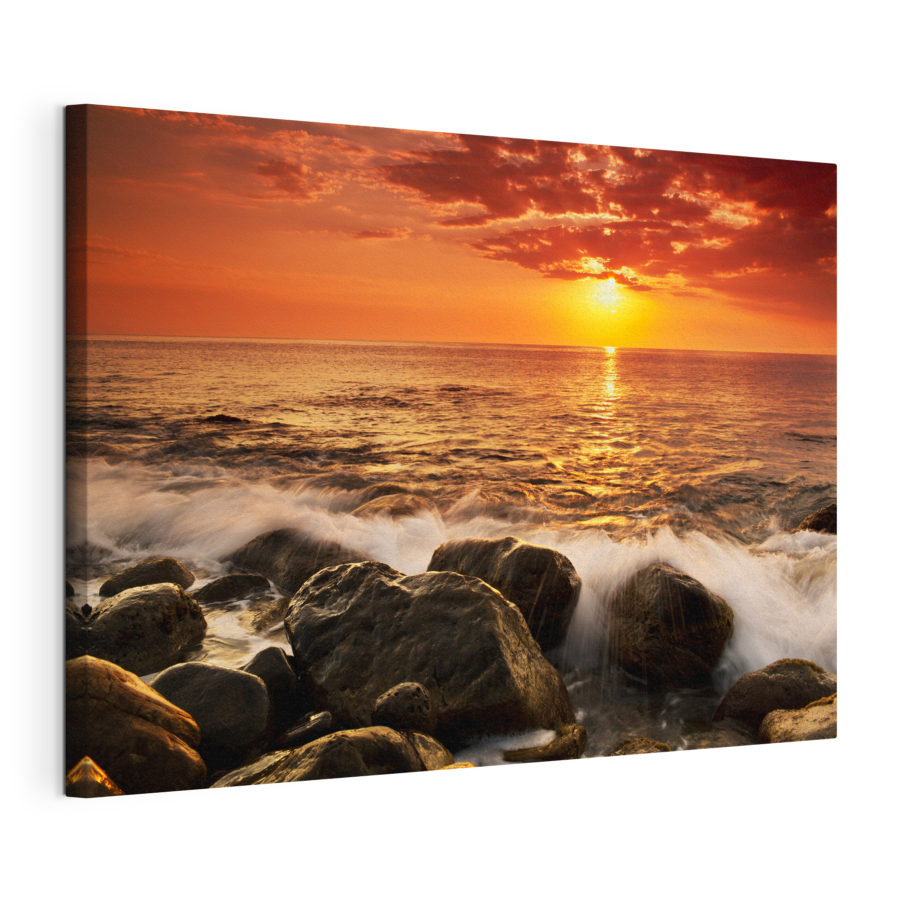 A sunset over a rocky beach