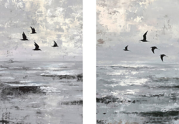 Group of birds flying over water