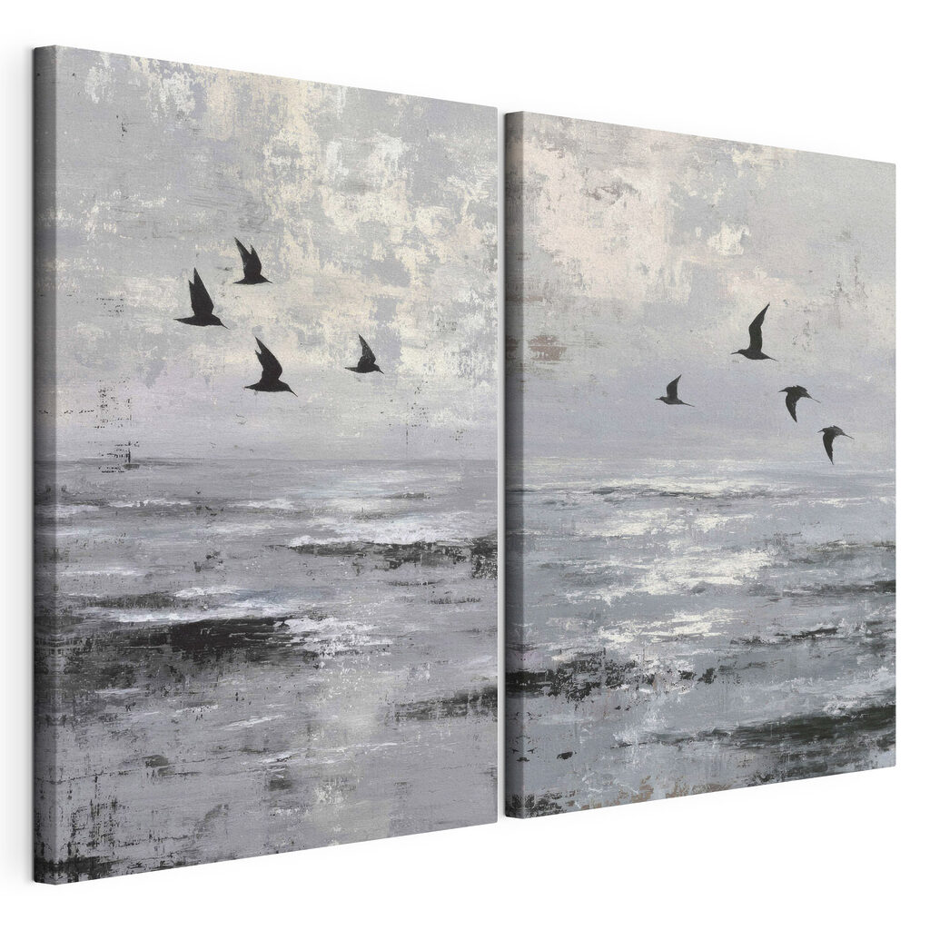 Group of birds flying over water
